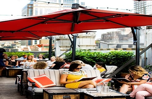 People sitting outside at Refinery Rooftop